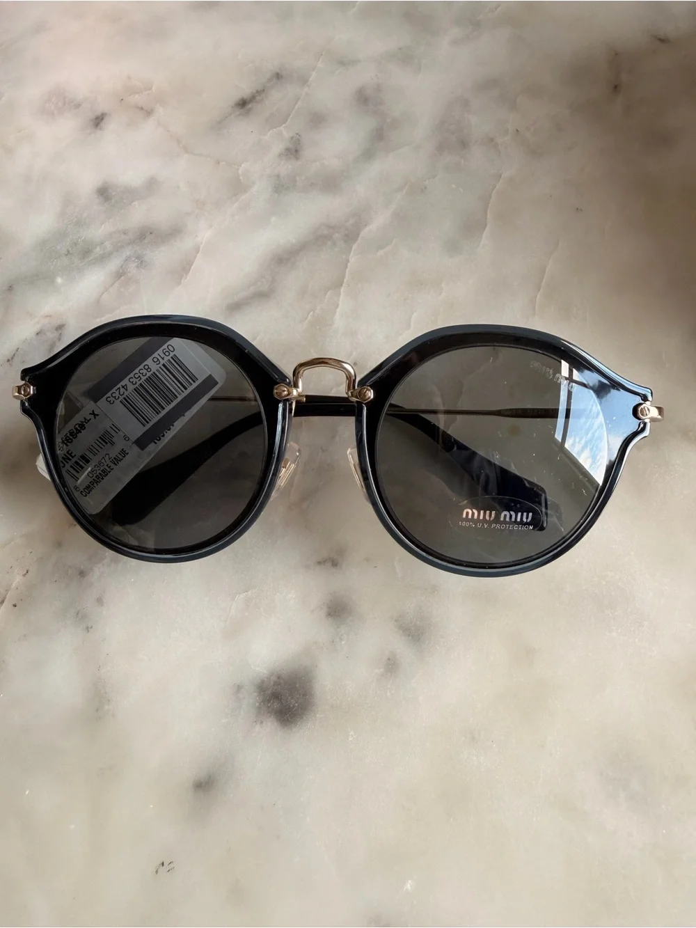 Miu Miu Round Sunglasses